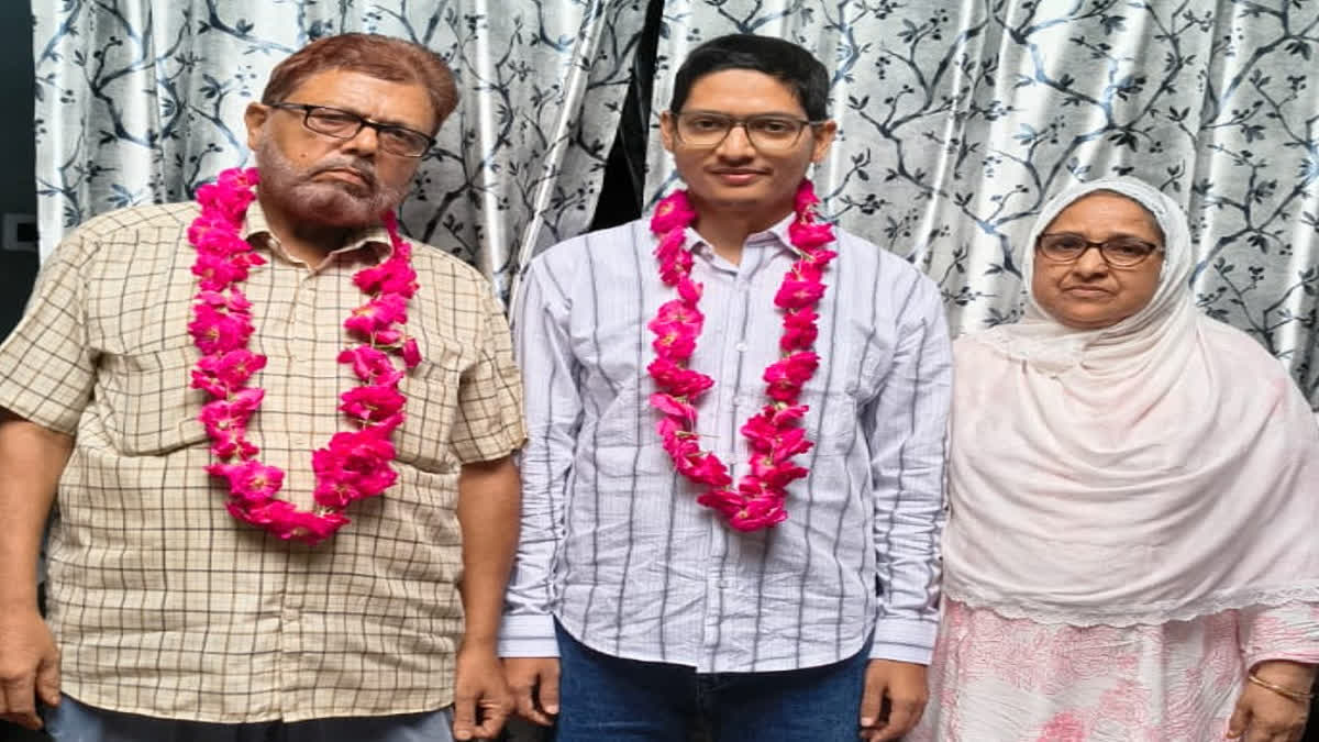 Altaf with his father and mother