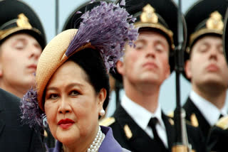 FILE - Queen Mother Sirikit passes by Russian honor guards while arriving in Moscow Vnukovo airport, July 2, 2007.