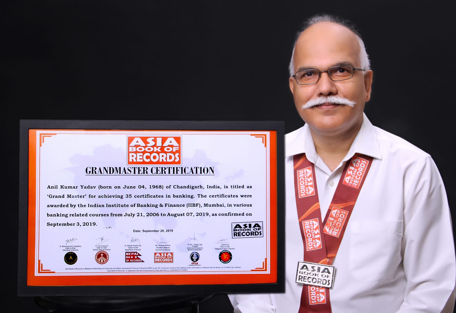 Dr Anil Kumar Yadav with the certification of the Asia Book of Records.