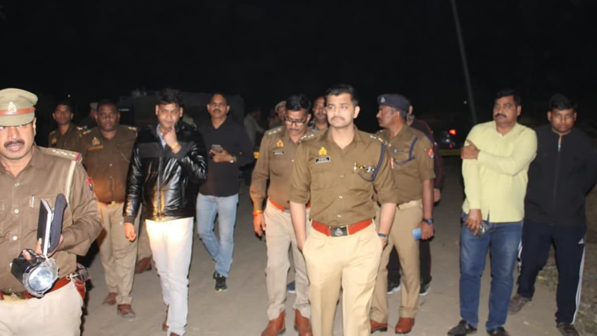 Police officials at the encounter site in Greater Noida.