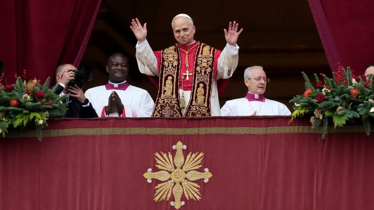 Pope Leo XIV waves after delivering the Urbi et Orbi (Latin for 'to the city and to the world' ) Christmas' day blessing from the main balcony of St. Peter's Basilica at the Vatican, Thursday, Dec. 25, 2025.