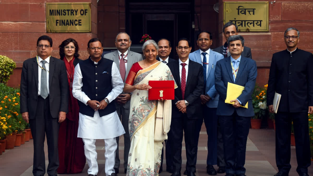 FILE- Union Finance Minister Nirmala Sitharaman shows the Budget tablet at Ministry of Finance before heading to the Parliament to present the Union Budget 2025.
