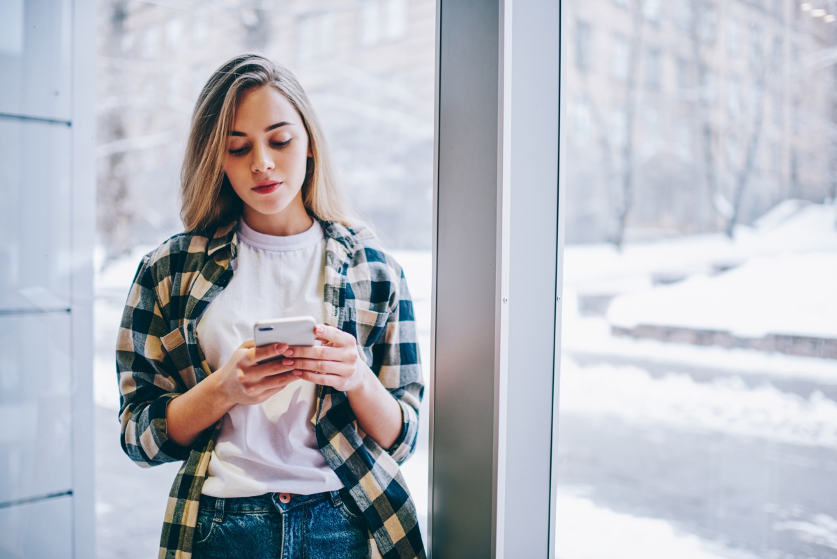 Teenager reading on her phone