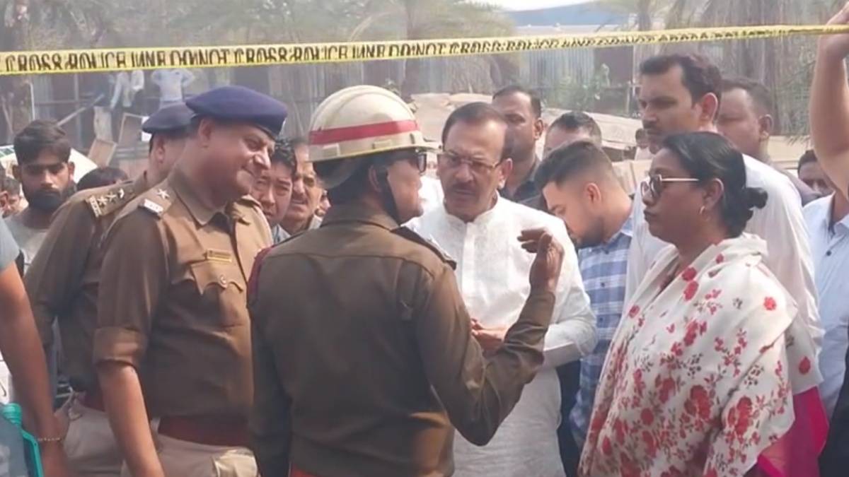 Minister Aroop Biswas speaks to fire brigade officials at the spot.