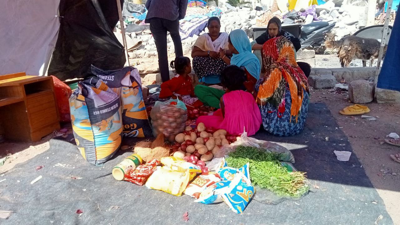 A family in a makeshift tent in Kogilu.