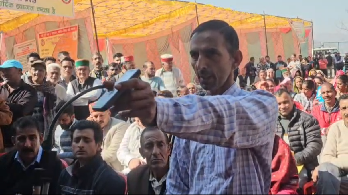 Complainant showing electricity bill to the Health Minister