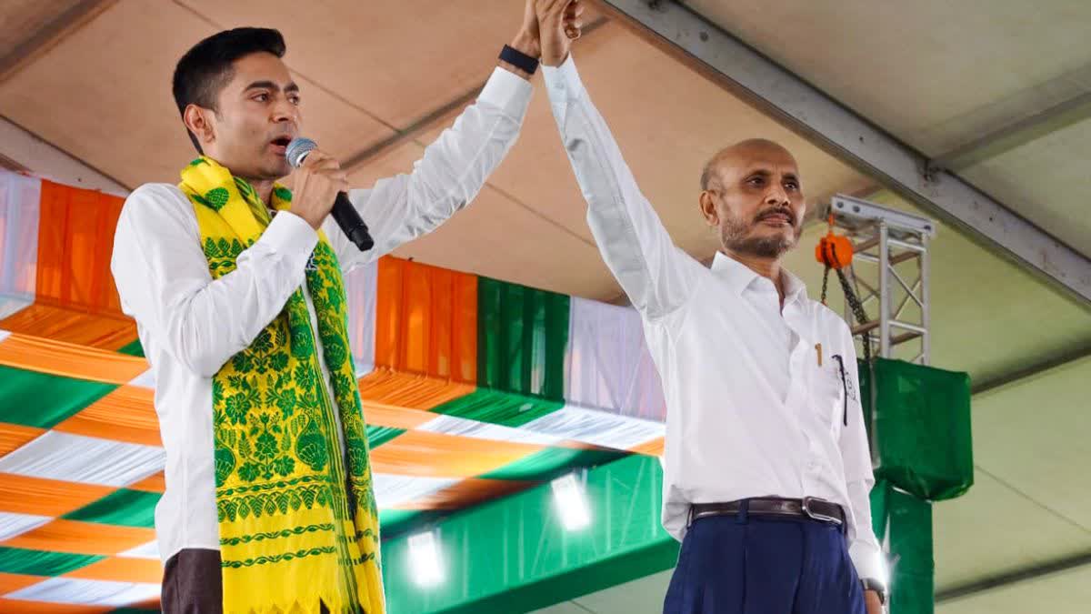Abhishek Banerjee with TMC's Dhupguri candidate Nirmal Chandra Roy at the election rally on Thursday