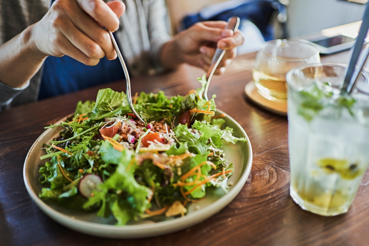 Person eating a salad