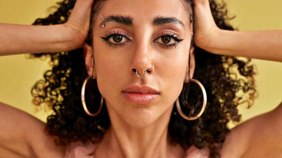 Ahead Of International Body Piercing Day 2026, Precautions To Take Before Your First Piercing Woman with piercings