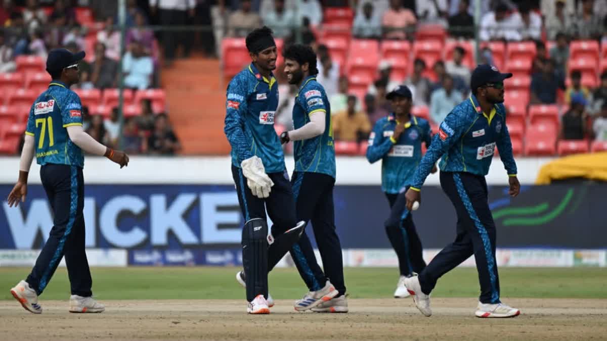 Hyderabad e-Champions celebrate the fall of a wicket during their league match against Medak Falcons at the Rajiv Gandhi International Stadium in Hyderabad on Saturday