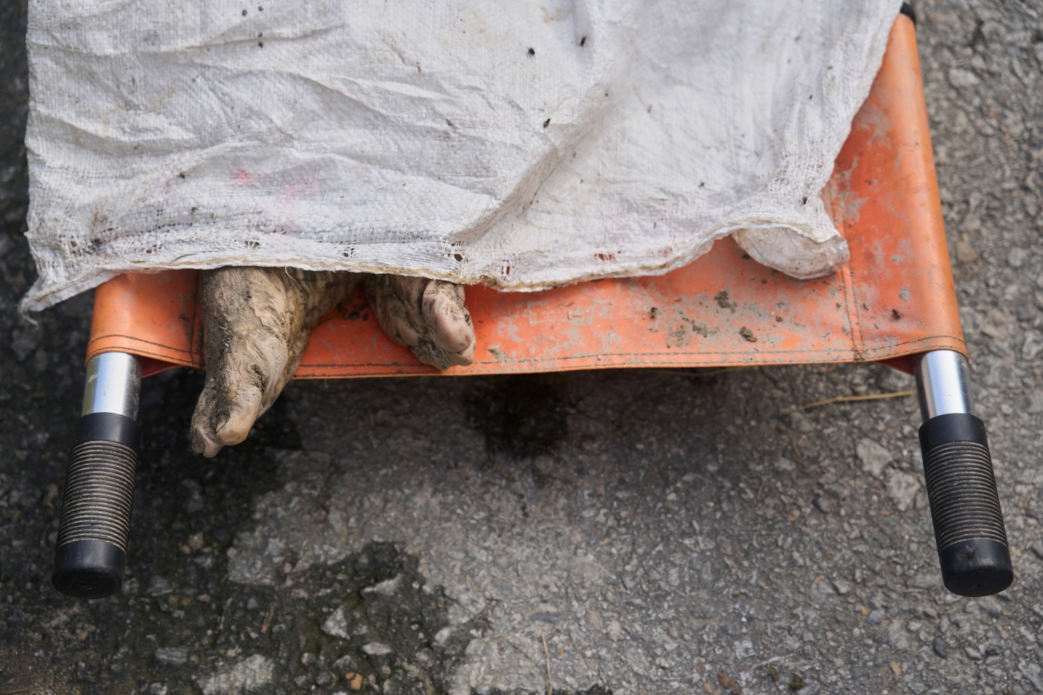 GRAPHIC CONTENT: A body of a victim lies on a stretcher in Nuwakot district of Nepal on Thursday.
