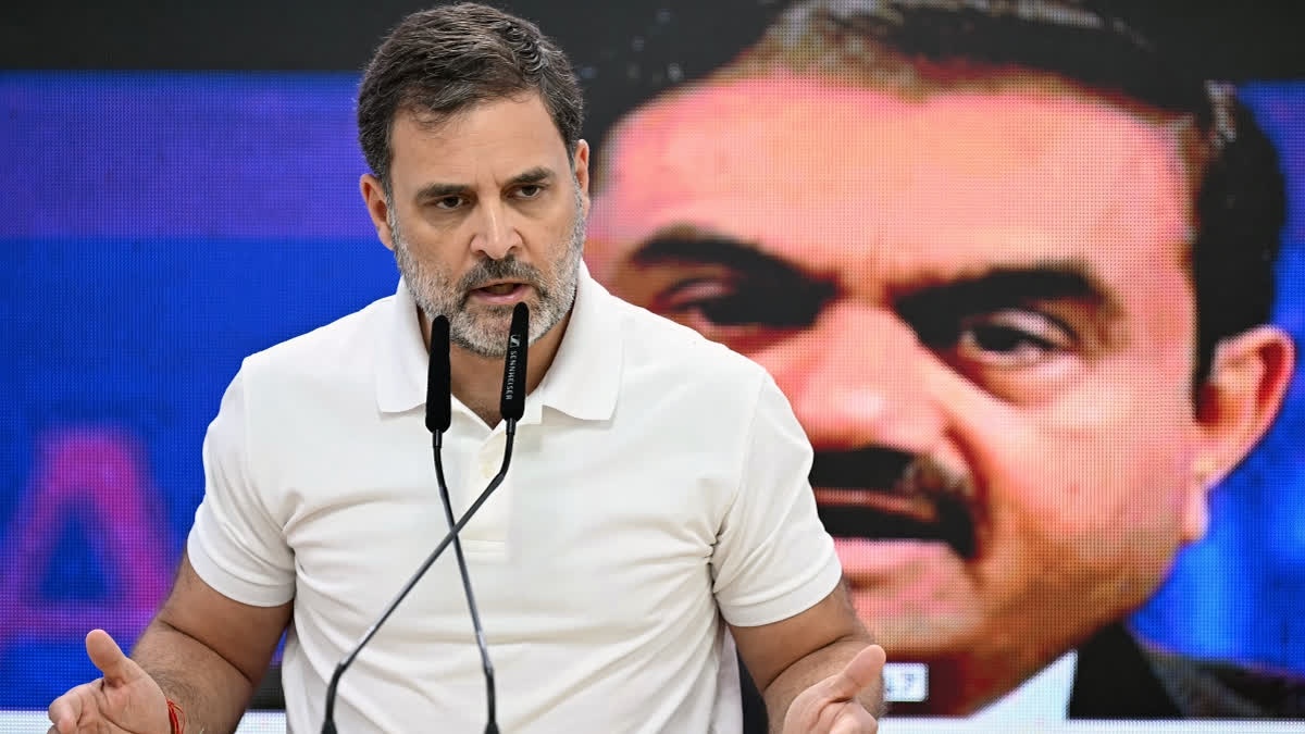 Indictment Row: Rahul Demands Adani's Arrest, Accuses Govt Of Protecting Him India's Congress party leader Rahul Gandhi addresses a press conference against the backdrop of a picture of Indian industrialist Gautam Adani, at his party headquarters in New Delhi on November 21, 2024.