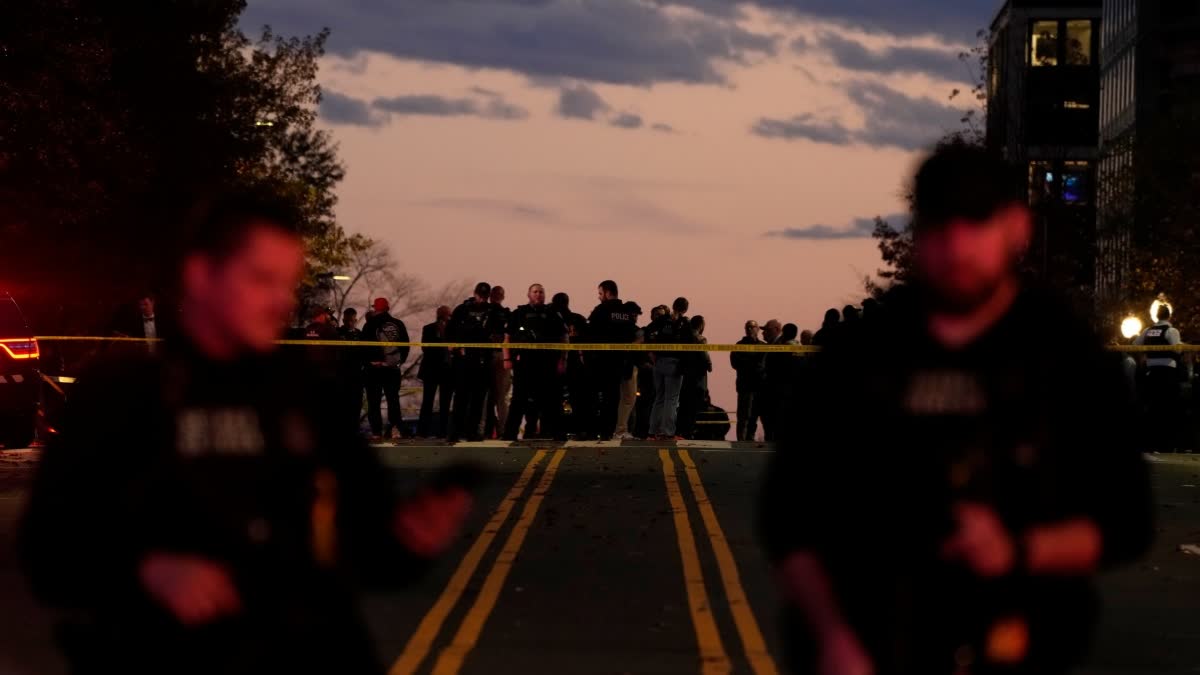 Emergency personnel keep a presence following the shooting of two National Guard soldiers near the White House, Wednesday