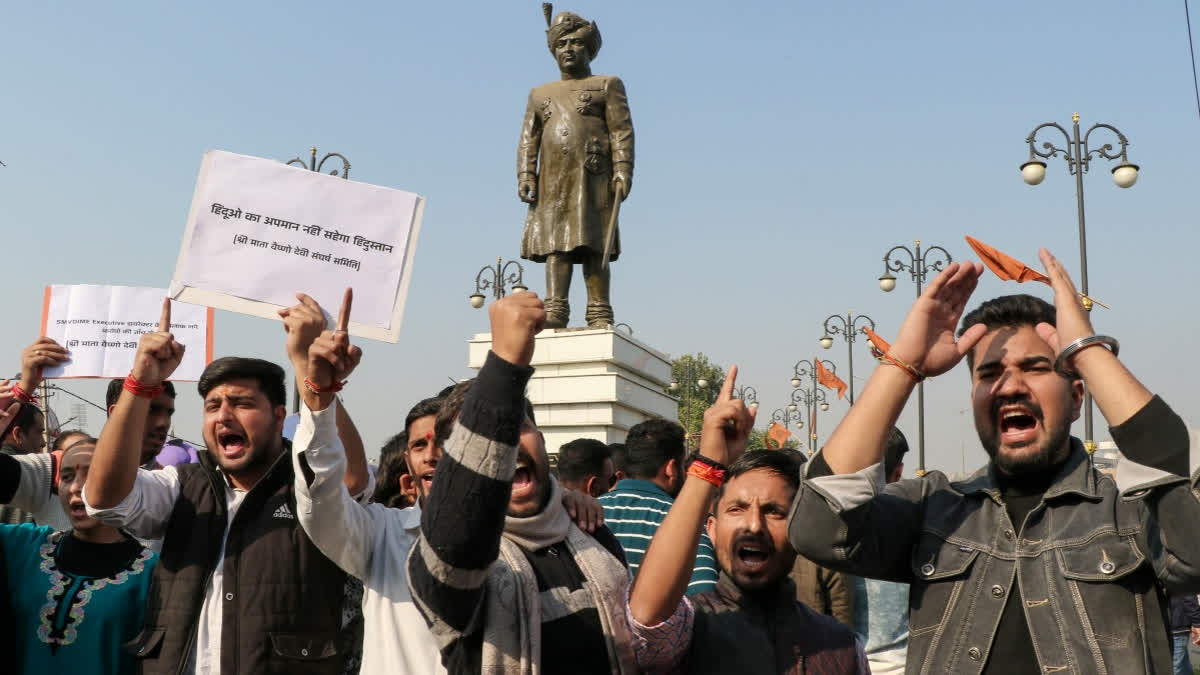 Members of the Shri Mata Vaishno Devi Sangharsh Samiti raise slogans during a protest, in Jammu on Friday, December 5, 2025. (
