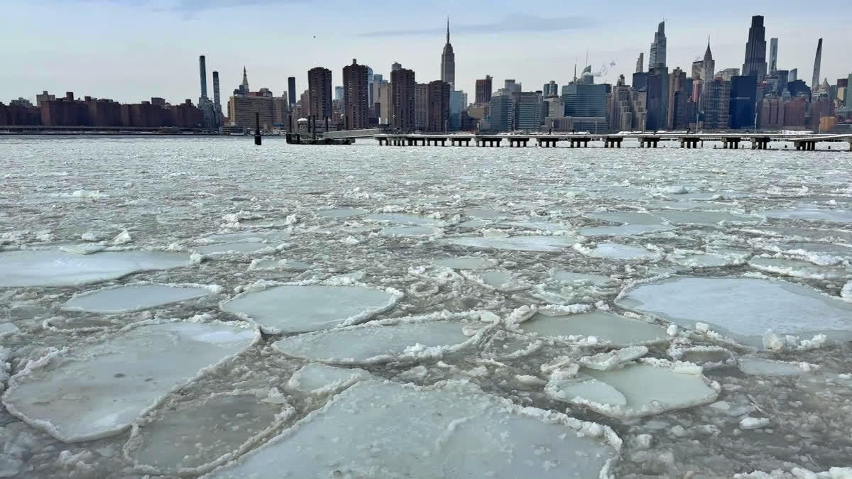 East River is covered in ice as freezing temperatures grip swathes of the country in a monster storm that has killed at least 30 people.