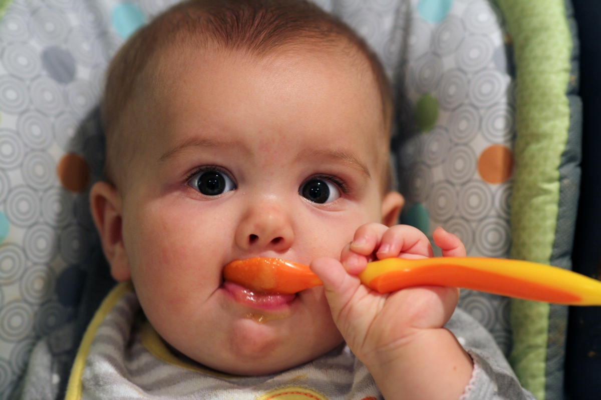 Baby eating mashed food