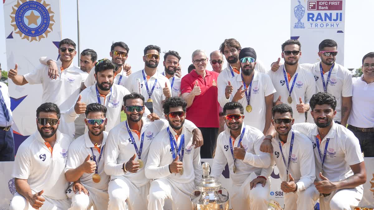Jammu and Kashmir Chief Minister Omar Abdullah poses with players during the felicitation ceremony after the team's victory in the Ranji Trophy 2025-26 final cricket match against Karnataka, at KSCA Stadium, in Hubballi, Karnataka, Saturday, Feb. 28, 2026.