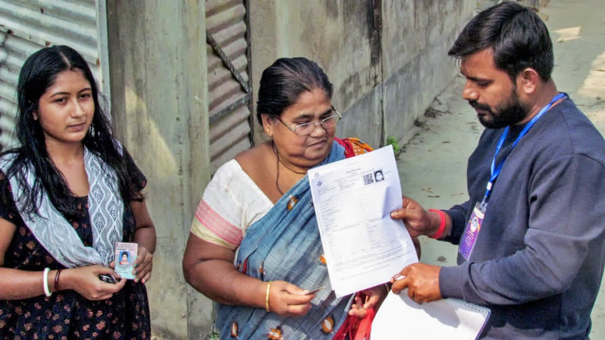 A file photo of officials distributing the SIR enumeration forms in the Karimpur assembly constituency in Nadia