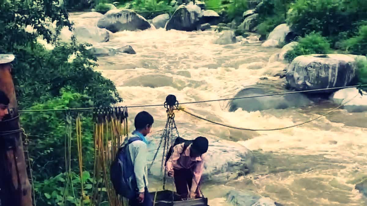 Students using rope swing to cross the river due to lack of bridge at Ghath village in Kathua, Jammu and Kashmir