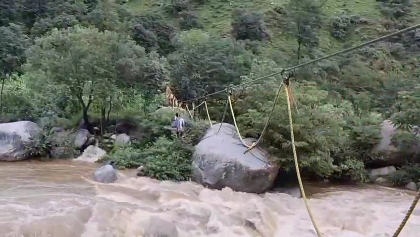 Students using rope swing to cross the river due to lack of bridge at Ghath village in Kathua, Jammu and Kashmir