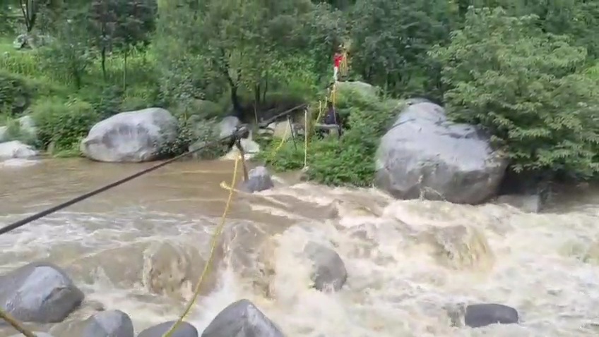 Students using rope swing to cross the river due to lack of bridge at Ghath village in Kathua, Jammu and Kashmir