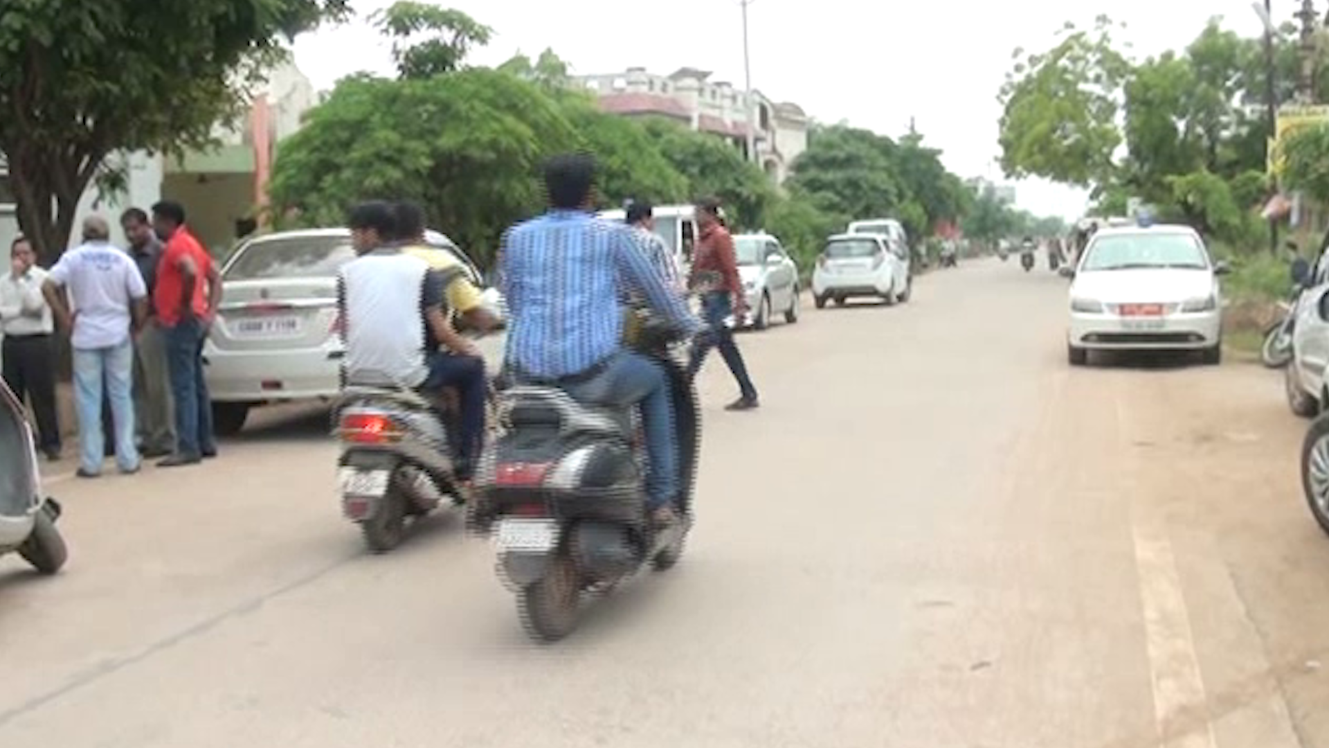 People driving two-wheelers without helmets