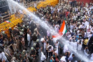 Police use water cannon on Congress workers during a protest march to the state election commission in Jaipur on Monday.