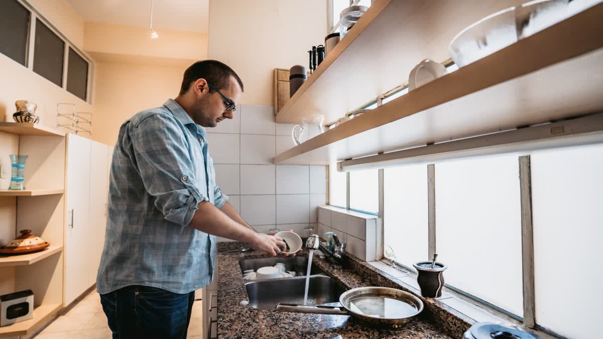 Man Washing Dishes