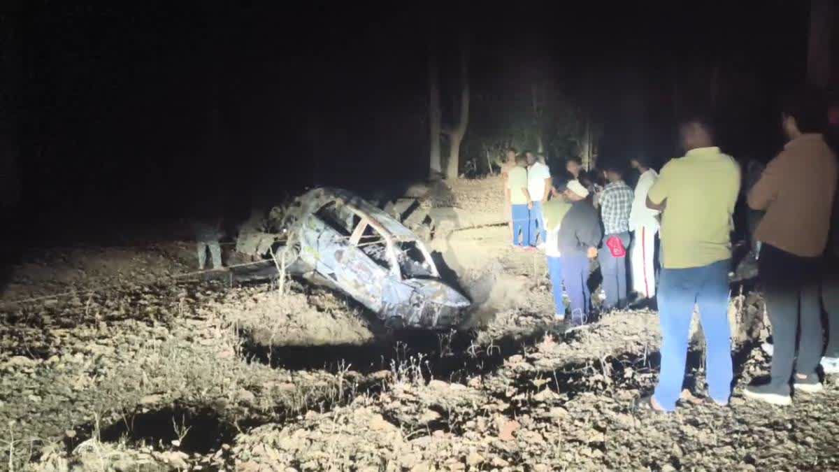 The charred remains of the car after the mishap.