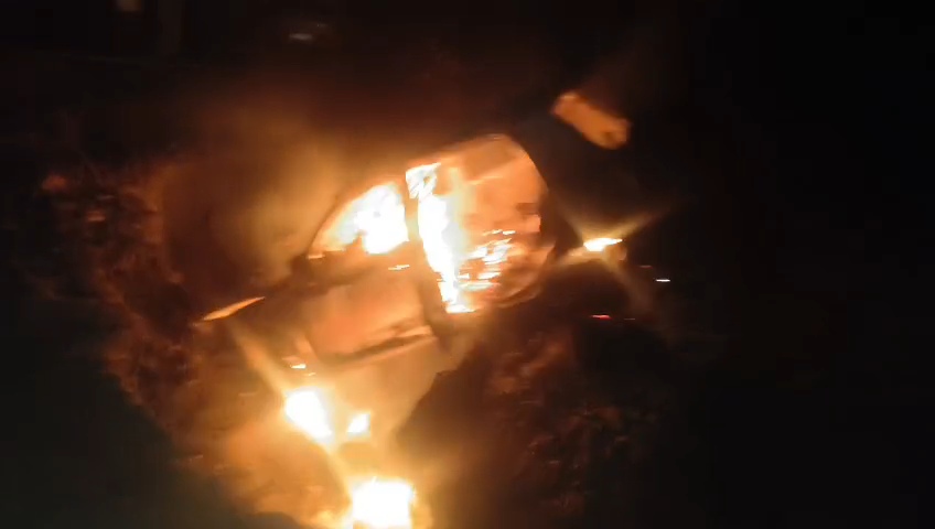 The burning car following the crash.