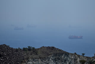 Tankers and bulk carriers anchored in the Strait of Hormuz, Saturday, April 18, 2026.