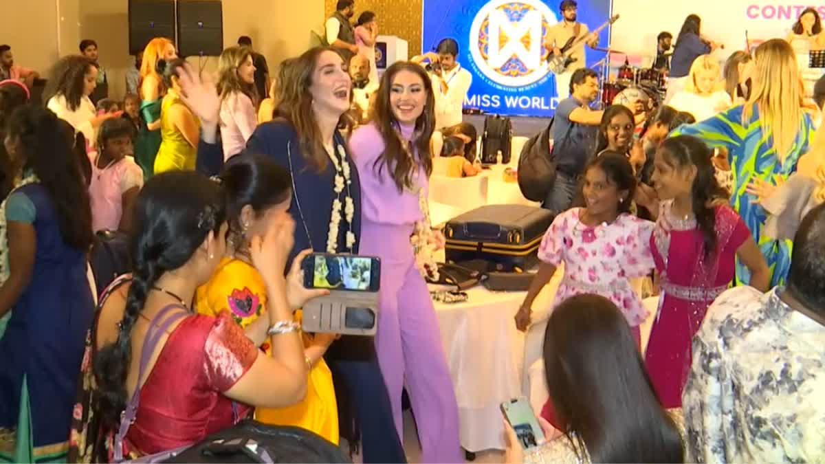 MISS WORLD CONTESTANTS WITH ORPHANS