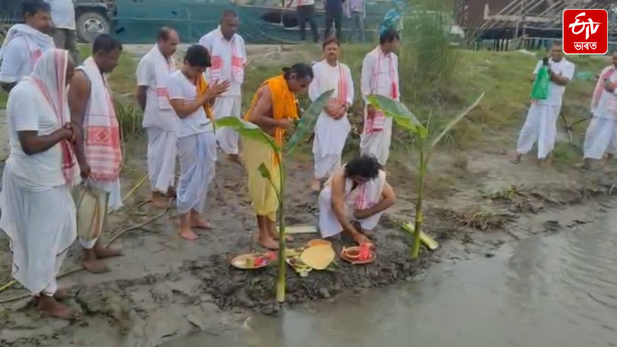 Employees of the Inland Water Transport department prayed to the Brahmaputra in Majuli