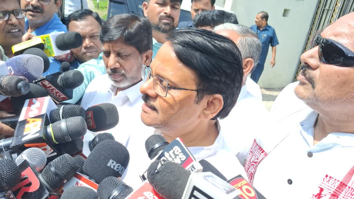 K. Raju interacting with media