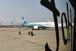 Airport staff workers at the Indira Gandhi International Airport, in New Delhi.
