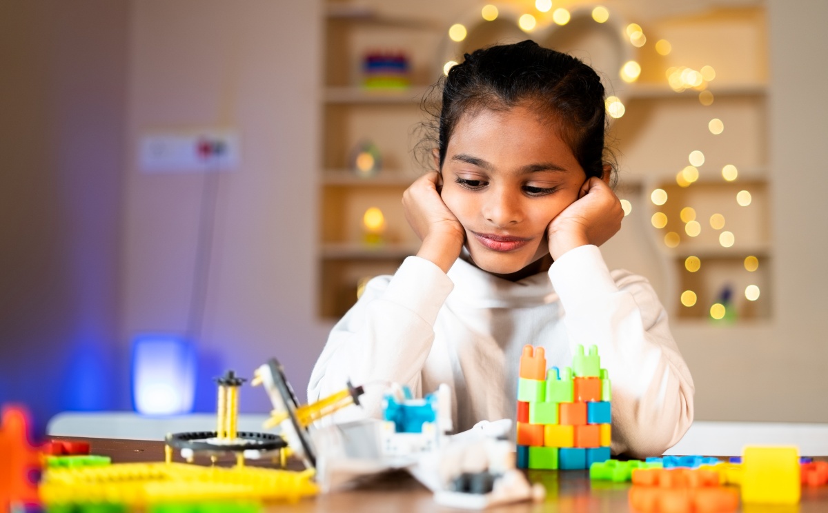 Girl playing with lego
