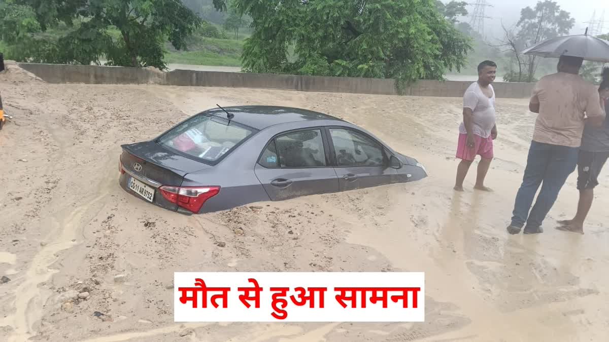 Overburden debris flows onto road