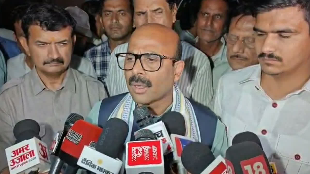In-charge Dwivedi speaking to the media.