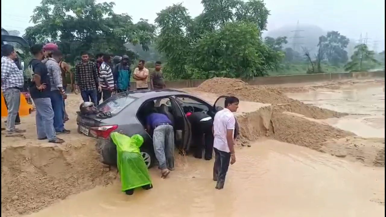 Overburden debris flows onto road