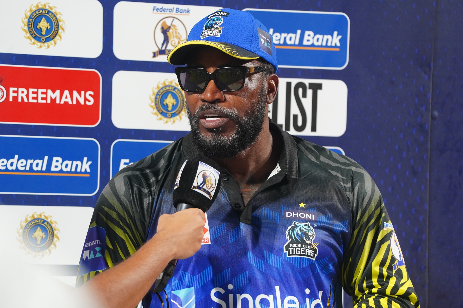 CHRIS GAYLE IN NEW ROLE IN KERALA UNIVERSE BOSS AURA TO BLUE TIGERS IT WILL TAKE TIME FOR WEST INDIES ROLE CHANGES FROM PLAYER TO OWNER