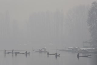 Boats sail on Dal Lake amid thick fog and low visibility on a cold morning in Srinagar on Thursday, November 27, 2025.