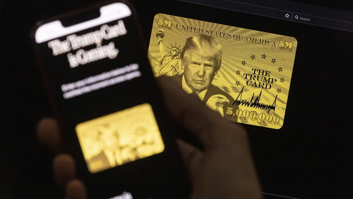 A poster of the “Trump Gold Card” is seen as President Donald Trump delivers remarks in the Oval Office at the White House on September 19, 2025 in Washington, DC.