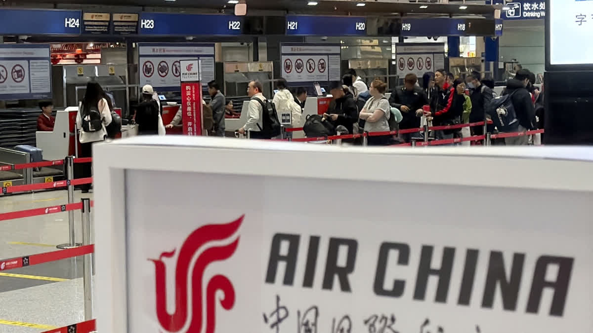 People line up in front of an Air China's counter for a direct flight between Beijing and North Korea's capital of Pyongyan, at Beijing Capital International Airport in Beijing Monday, March 30, 2026.