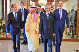 In this photo released by the Pakistan Ministry of Foreign Affairs, from left, Egyptian Foreign Minister Badr Abdelatty, Saudi Arabia's Foreign Minister Prince Faisal bin Farhan Al-Saud, Pakistan's Foreign Minister Ishaq Dar and Turkish Foreign Minister Hakan Fidan walk prior to their meeting to discuss the Middle East war, in Islamabad, Pakistan, Sunday, March 29, 2026.