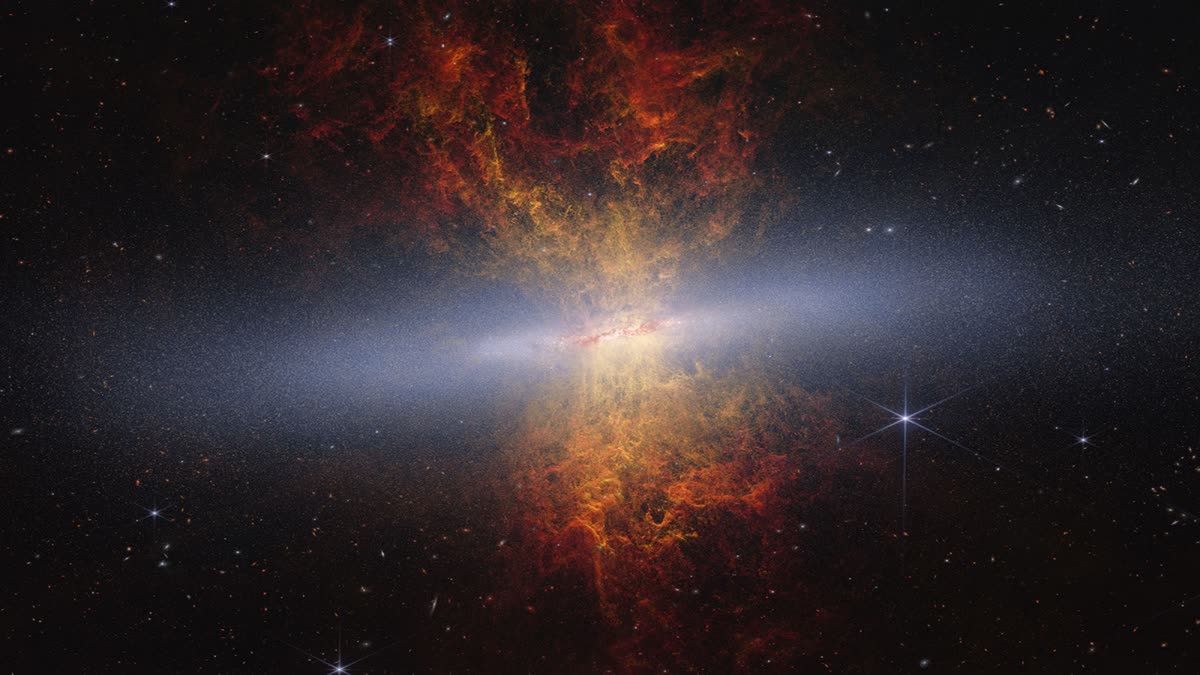 Scientists used NASA’s James Webb Space Telescope to image edge-on starburst galaxy Messier 82 and trace its evolutionary history. This Webb and Hubble composite image includes 16.5 million stars (blue-white), dust grains (red-orange), and ionized hydrogen gas (yellow).