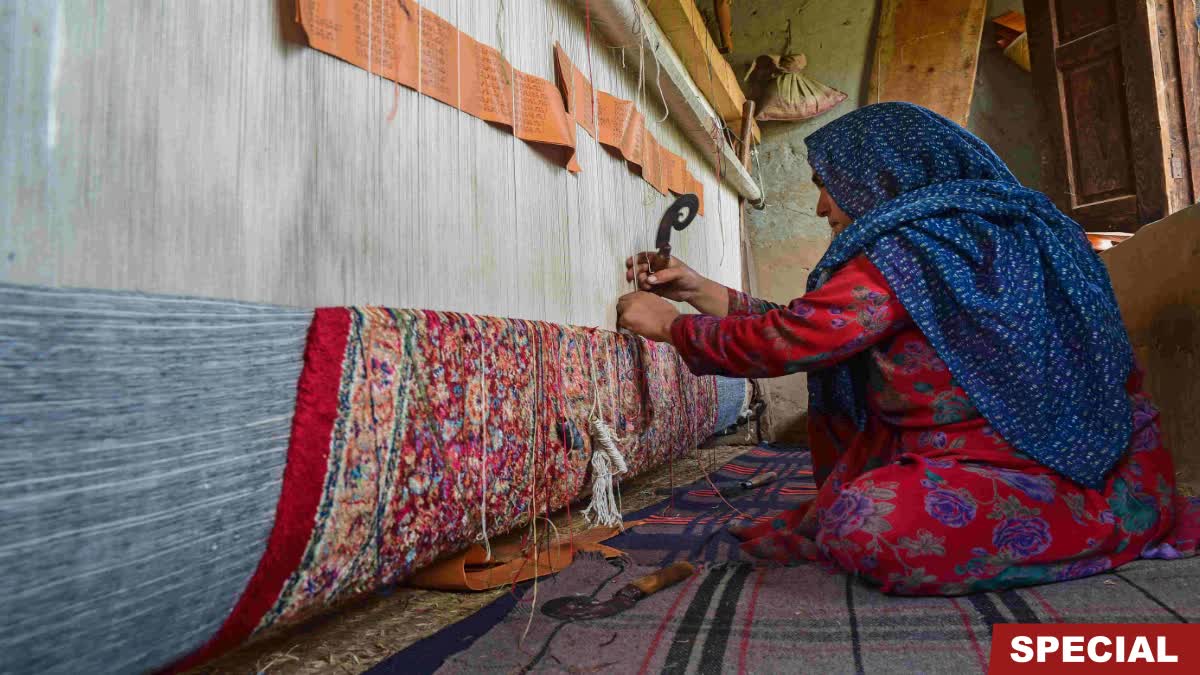 Kashmiri weaver working on a carpet