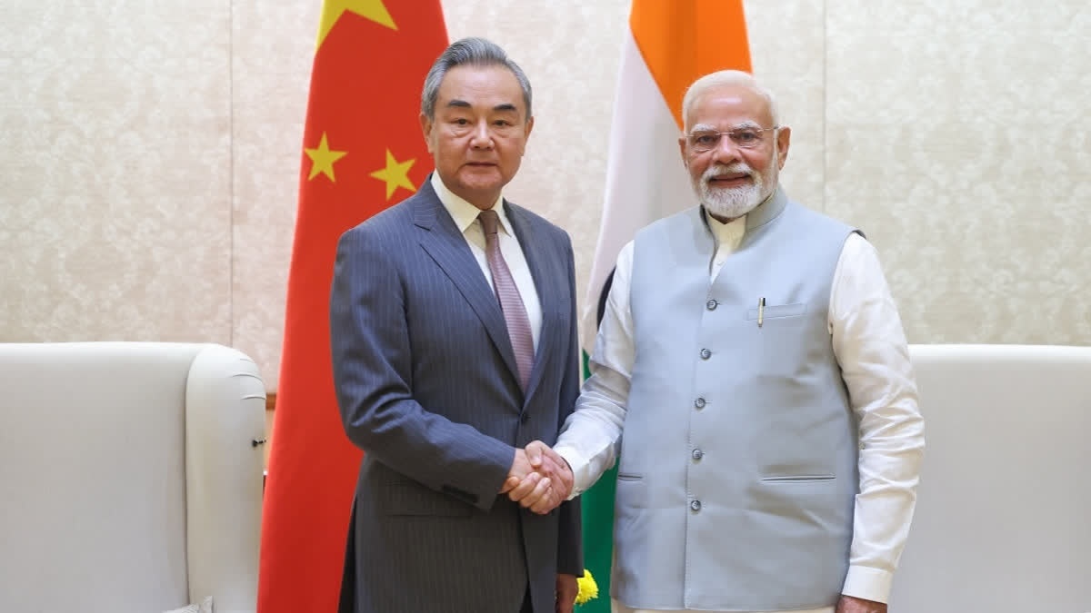 Prime Minister Narendra Modi with Chinese Foreign Minister Wang Yi during a meeting, in New Delhi