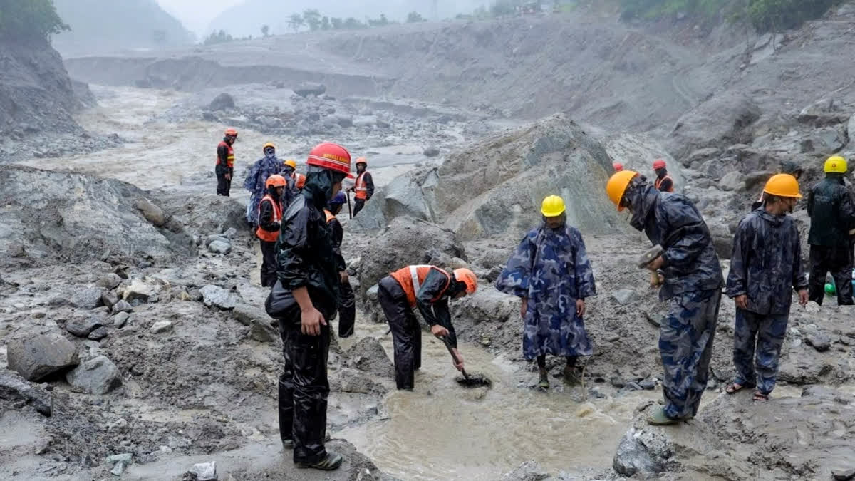 In this image posted on Aug. 29, 2026, Rescue efforts continue for the second day to evacuate people reportedly trapped inside a tunnel of the Trishuli 3 A Hydropower Project, with teams working to clear the debris blocking its entrance, in Rasuwa