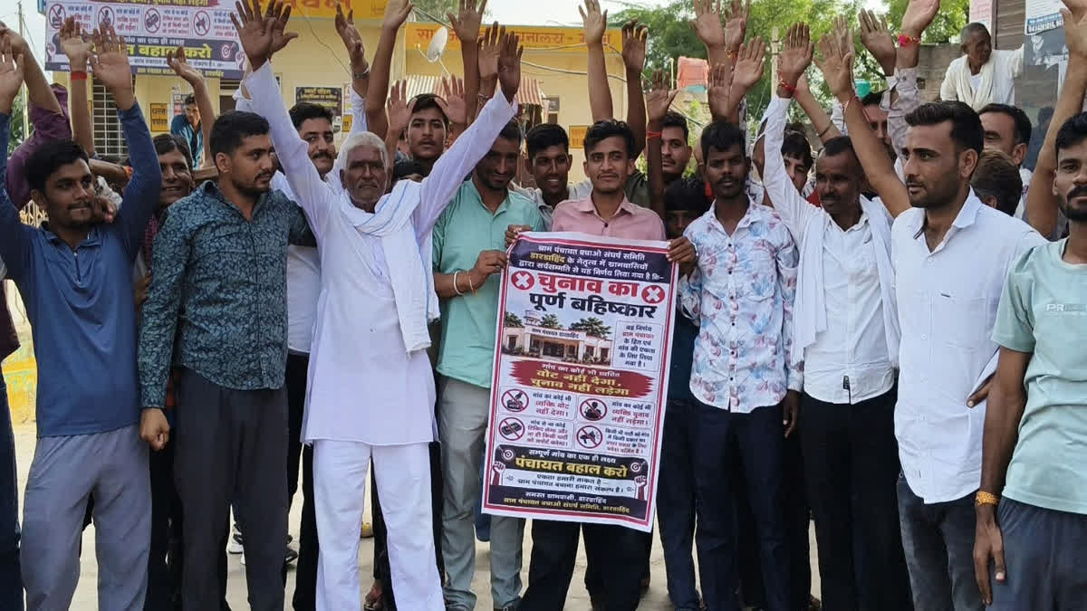 Villagers carrying banners boycotting the elections