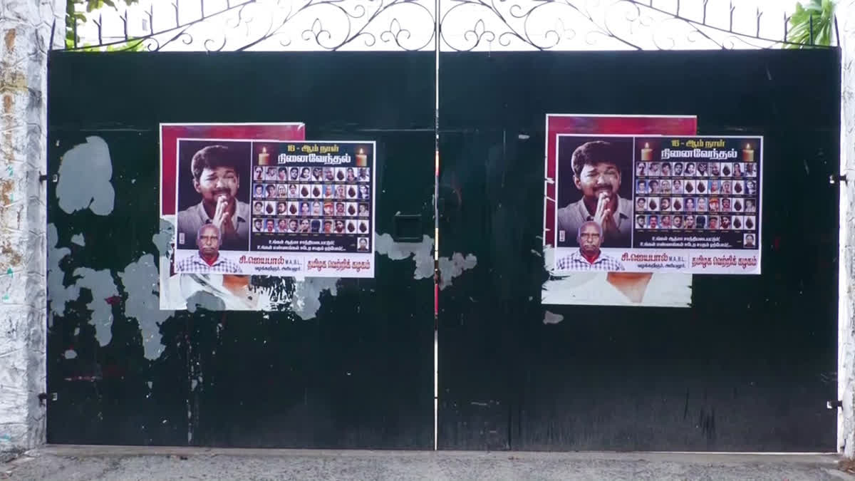 Posters paste on the gate with the photos of 41 people who died in the Karur Stampede at the TVK Head office